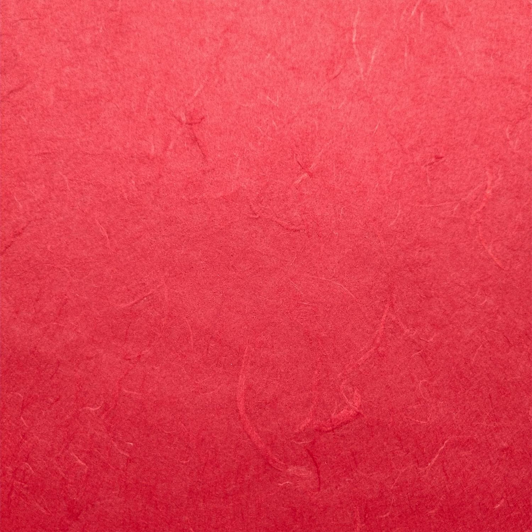 Detailed view of Unryu-style mulberry paper from Kozo Studio with visible fibers and elegant handmade paper folds.