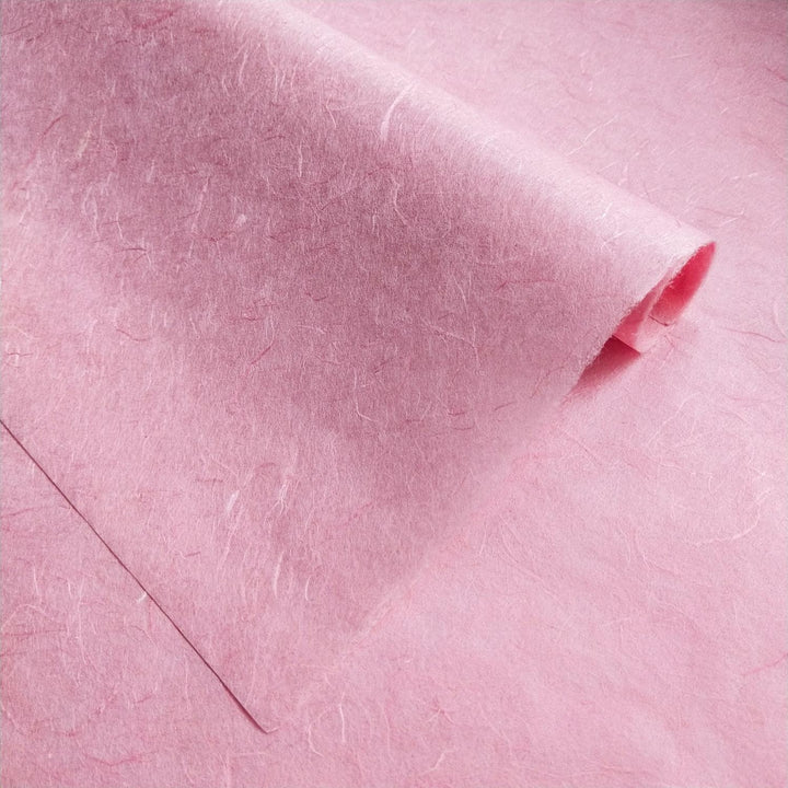 Diagonally folded Unryu Kozo Studio paper highlights the soft pink tones and organic texture of mulberry paper.