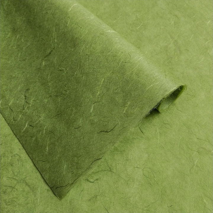 Kozo Studio mulberry paper in Fern Green with organic textures and unrefined fibers for a natural, handmade look.