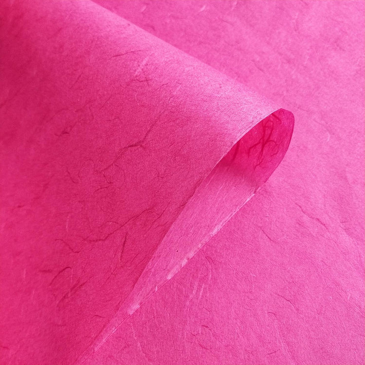 Detailed image of Unryu-style handmade paper crafted by Kozo Studio using mulberry fibers, with visible texture and rich color.