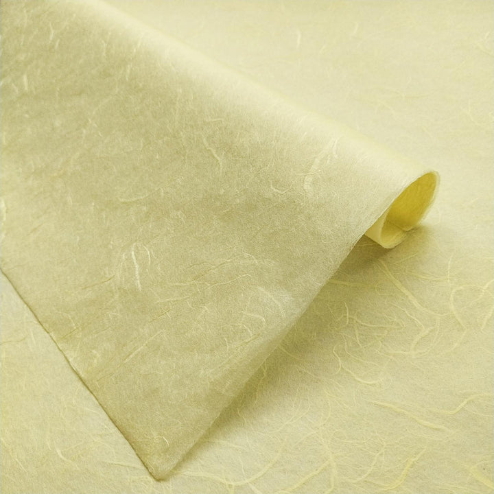Kozo Studio Unryu paper in lemon yellow, featuring the unique fibrous texture of traditional handmade mulberry paper.