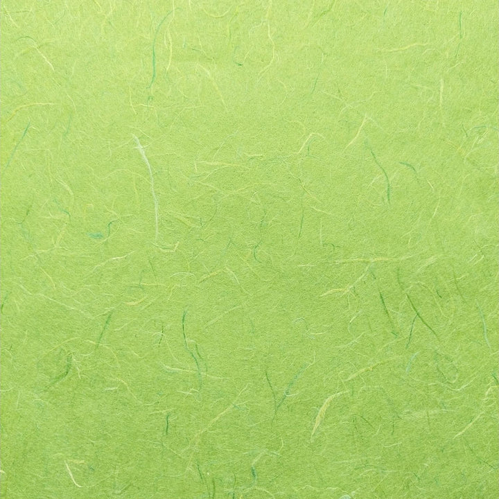 Textured mulberry paper in lime green by Kozo Studio showcasing crumpled handmade paper surface and natural fibers.