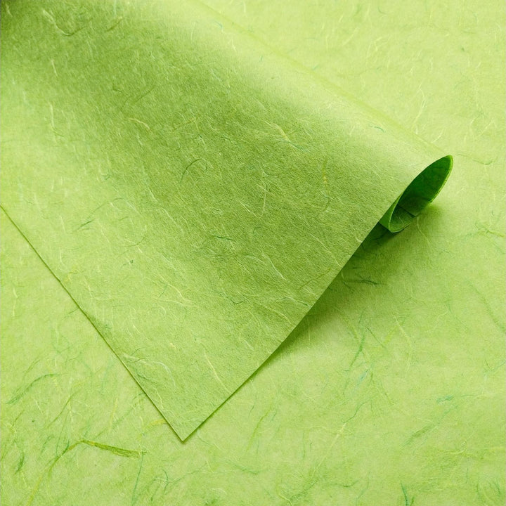 Kozo Studio lime green Unryu paper made from mulberry fiber with visible threads and handcrafted texture.