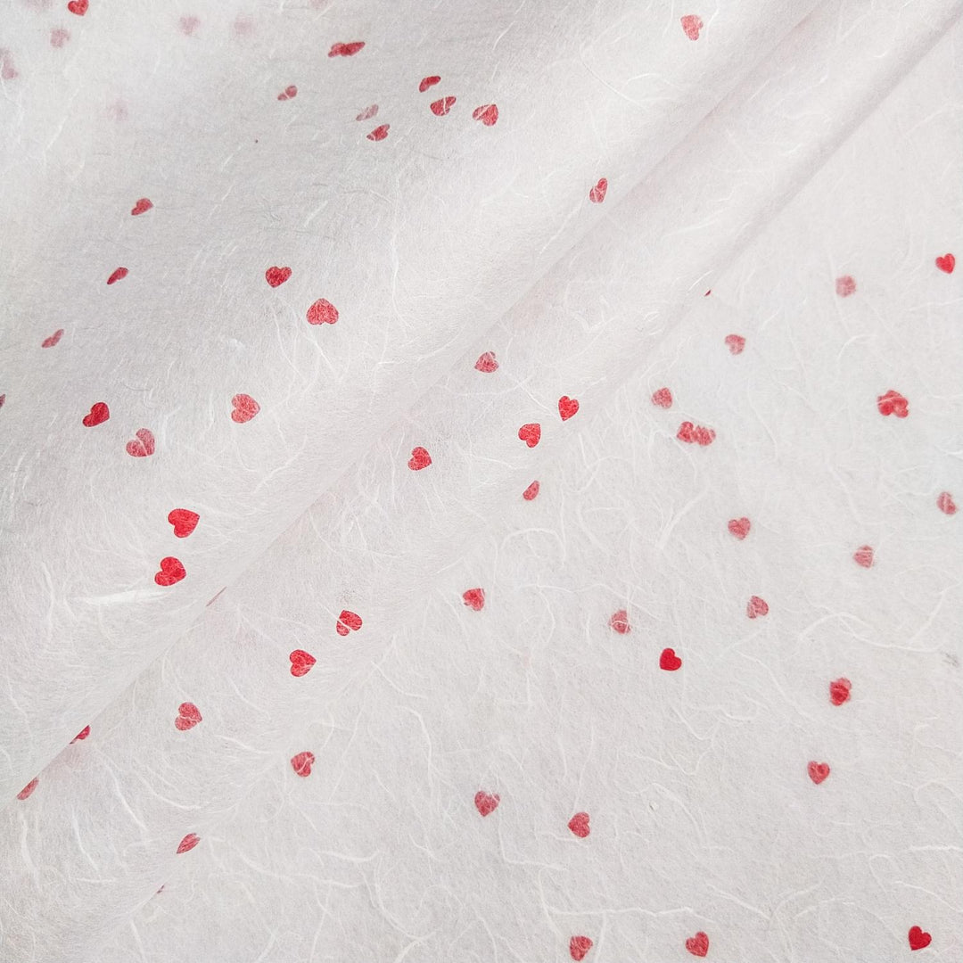 White mulberry paper with red heart accents in a romantic design by Kozo Studio, showcasing delicate handmade paper textures.