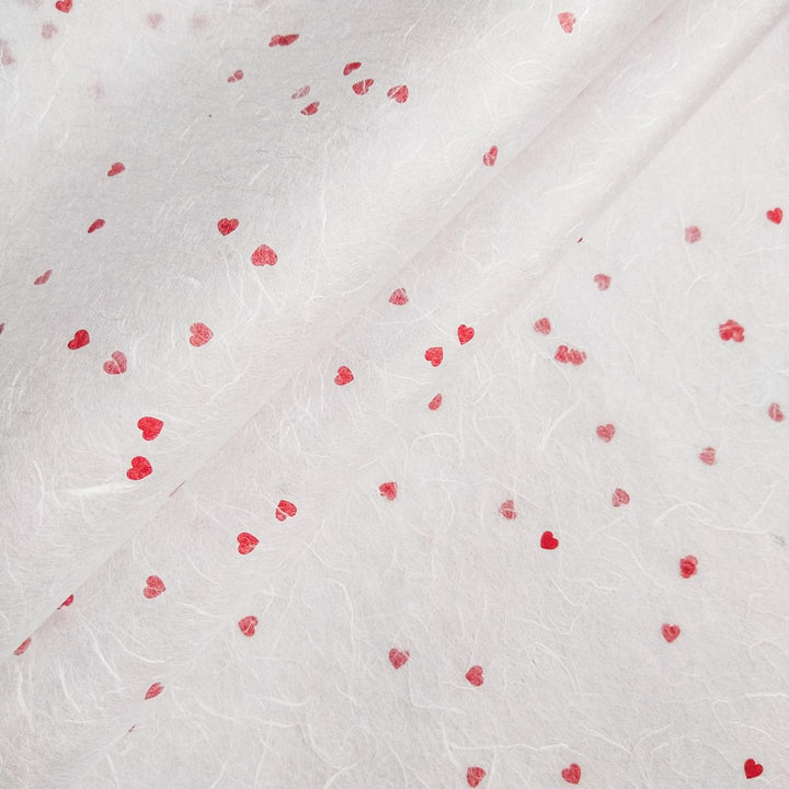 White mulberry paper with red heart accents in a romantic design by Kozo Studio, showcasing delicate handmade paper textures.