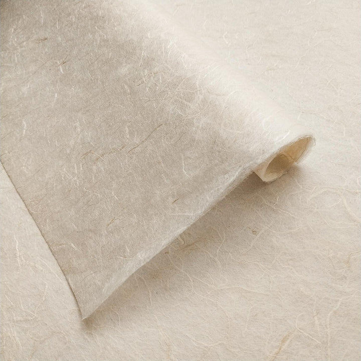 Kozo Studio mulberry paper sheet in its natural tone, showcasing the unique handmade texture and fiber patterns.