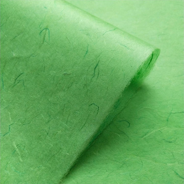 Kozo Studio's Unryu handmade mulberry paper in Poison Green, showing intricate rice fiber patterns and artisanal craftsmanship.