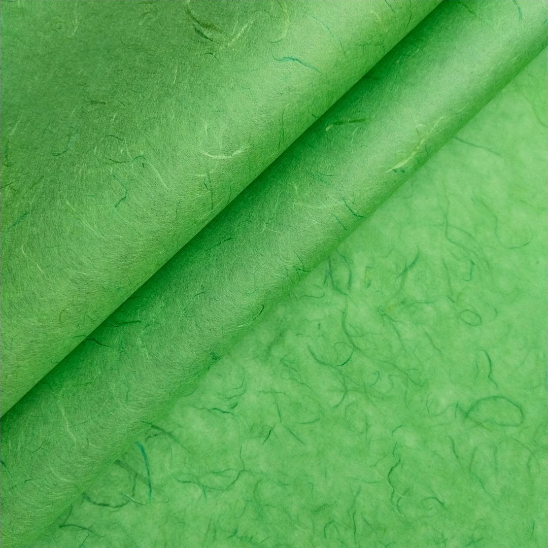 Close-up of green Unryu mulberry paper by Kozo Studio, highlighting the natural fibers and delicate texture of handmade paper.