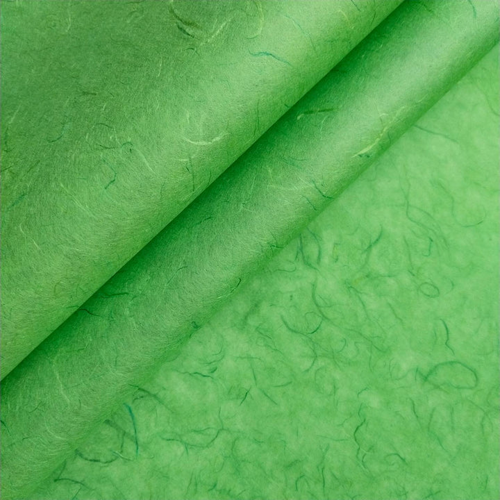 Close-up of green Unryu mulberry paper by Kozo Studio, highlighting the natural fibers and delicate texture of handmade paper.