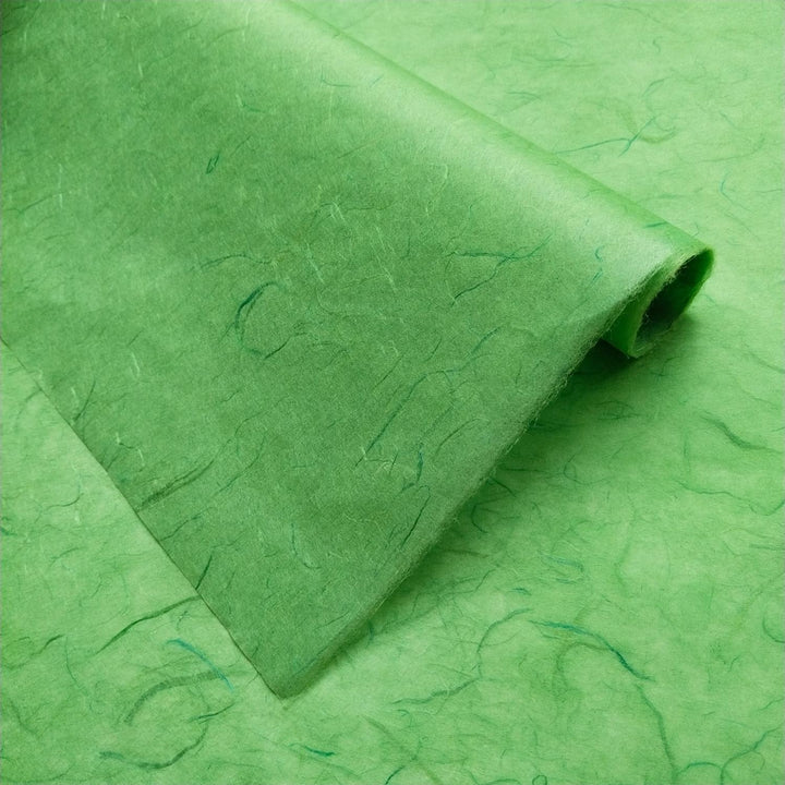 Detailed view of Poison Green Unryu handmade paper from Kozo Studio, featuring visible fibers and traditional mulberry paper texture.