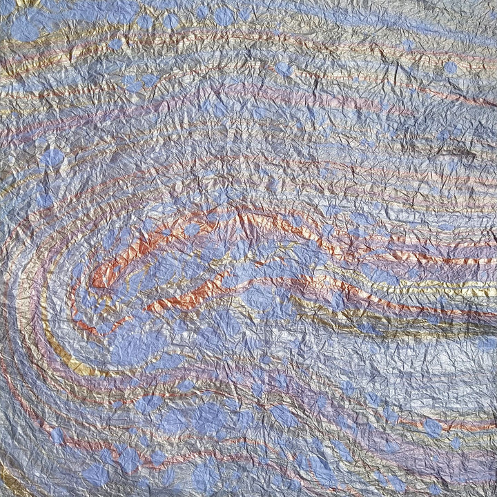 Decorative light blue marbled handmade paper created by Kozo Studio, featuring artisanal patterns on textured mulberry paper.