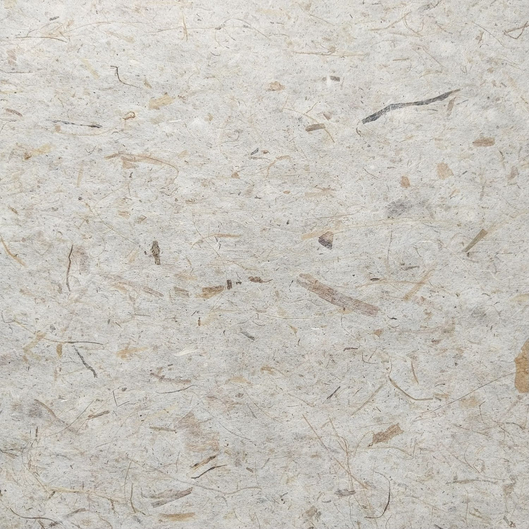 Natural handmade paper crafted by Kozo Studio, featuring banana fiber and mulberry paper in a textured, durable sheet ideal for creative projects.
