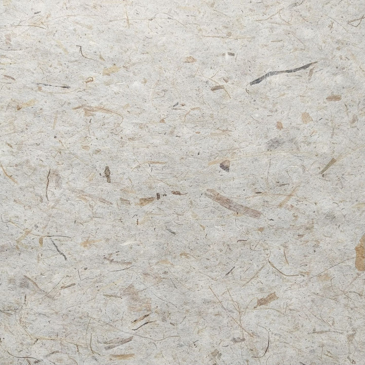 Natural handmade paper crafted by Kozo Studio, featuring banana fiber and mulberry paper in a textured, durable sheet ideal for creative projects.