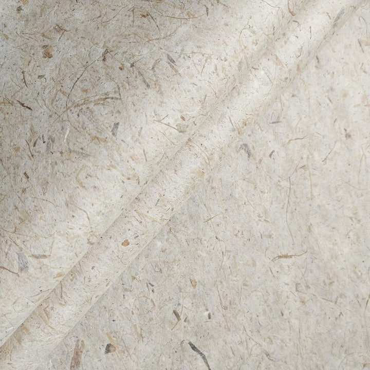Close-up of handmade Banana Kozo paper from Kozo Studio, showcasing its fibrous mulberry paper texture blended with banana trunk for a natural, earthy look.