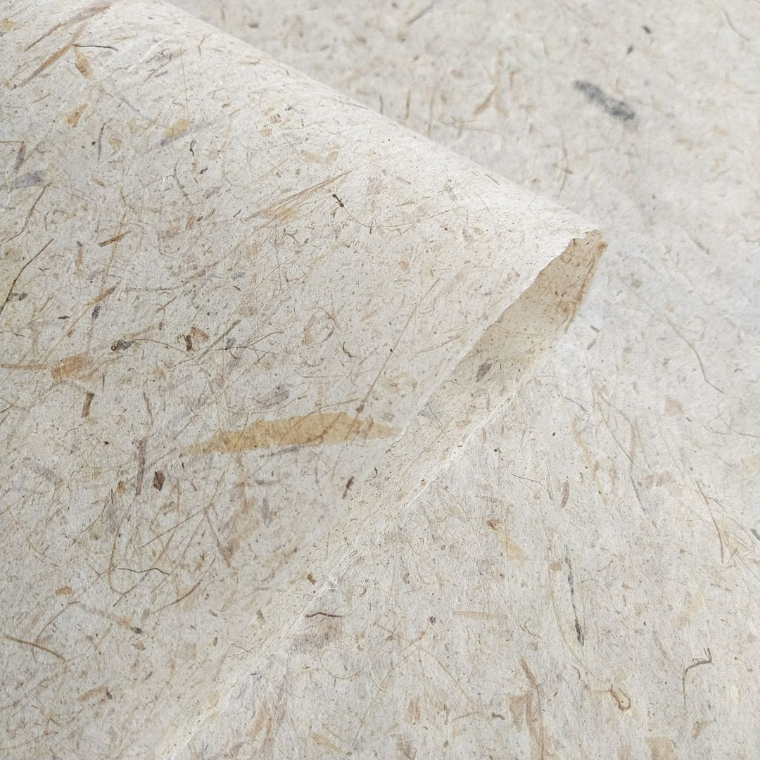 A textured view of Banana Kozo handmade paper by Kozo Studio, highlighting its blend of mulberry paper and banana fiber for crafts and design.