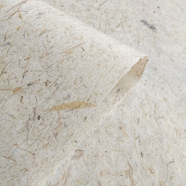 A textured view of Banana Kozo handmade paper by Kozo Studio, highlighting its blend of mulberry paper and banana fiber for crafts and design.