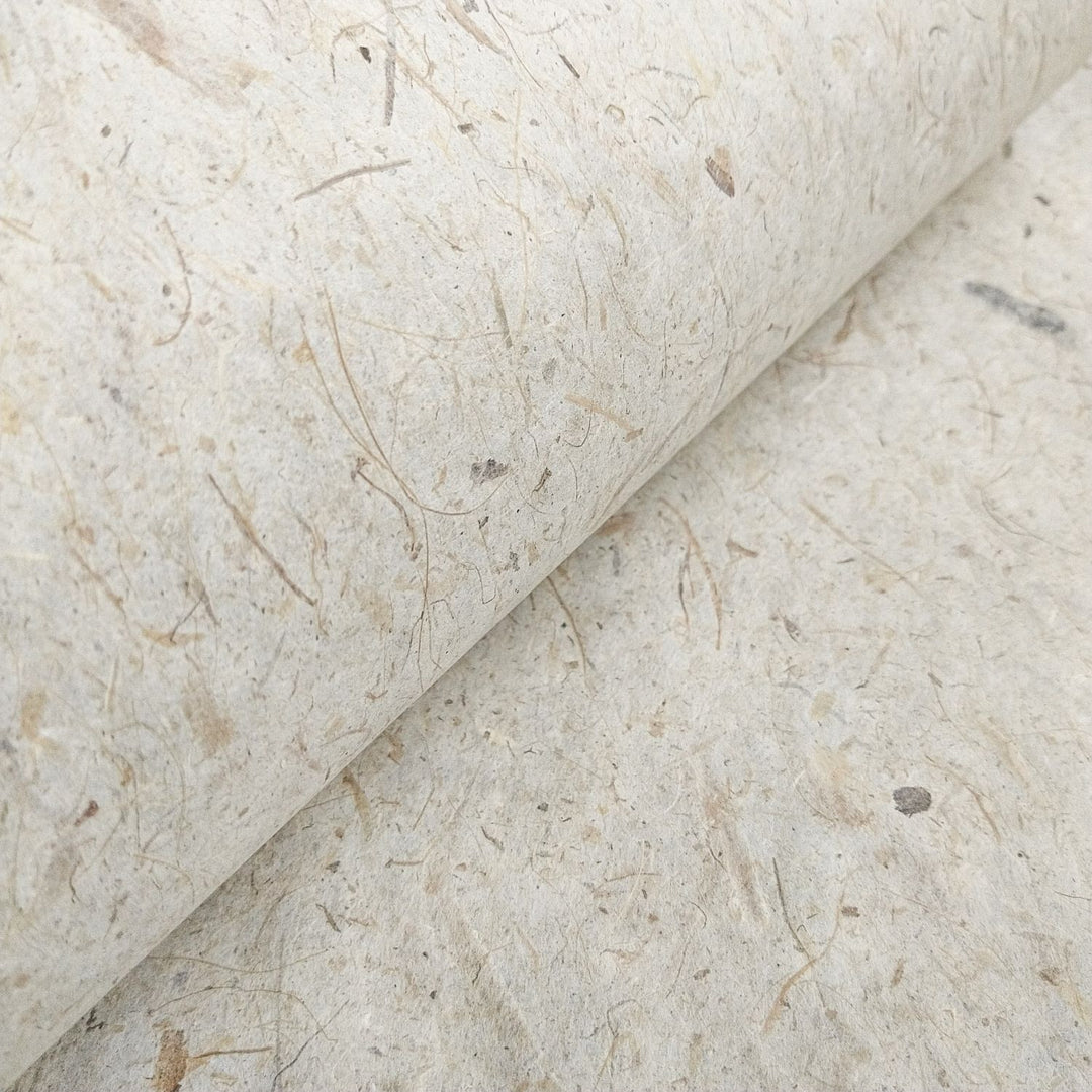 Artistic close-up of Kozo Studio's handmade Banana Kozo paper, with strong yet lightweight mulberry fibers and a rustic banana-infused surface.