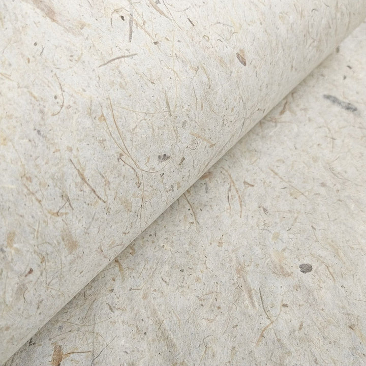 Artistic close-up of Kozo Studio's handmade Banana Kozo paper, with strong yet lightweight mulberry fibers and a rustic banana-infused surface.