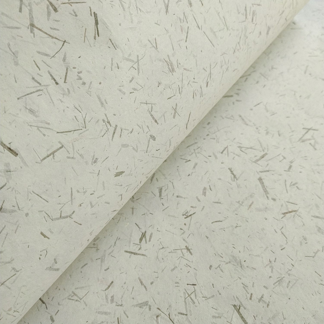 Artisan-style handmade paper made with mulberry pulp and bamboo elements by Kozo Studio, perfect for DIY and creative projects needing natural texture.
