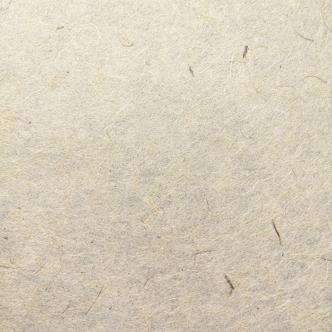 Detail view of Kozo Studio's handmade jute and mulberry paper, showing the organic texture perfect for artistic and sustainable craft use.
