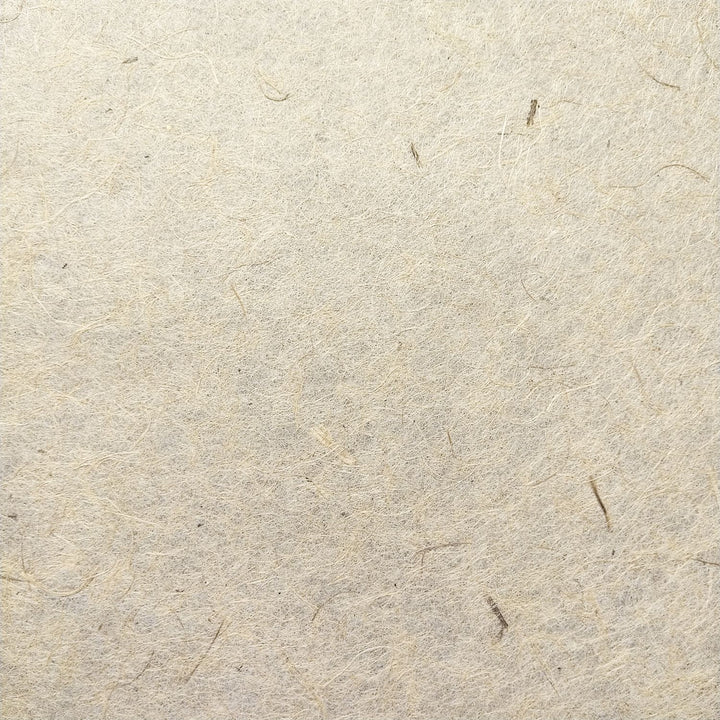 Detail view of Kozo Studio's handmade jute and mulberry paper, showing the organic texture perfect for artistic and sustainable craft use.