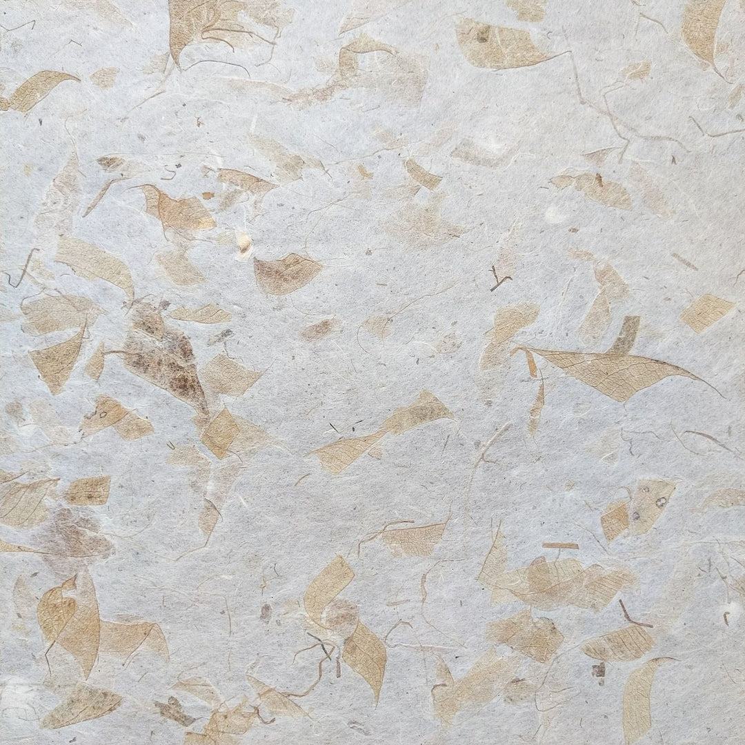 A detailed view of Kozo Studio's mango leaf mulberry paper, highlighting its warm, fibrous look and lightweight handmade structure, ideal for crafts and art.