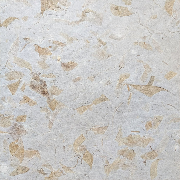 A detailed view of Kozo Studio's mango leaf mulberry paper, highlighting its warm, fibrous look and lightweight handmade structure, ideal for crafts and art.