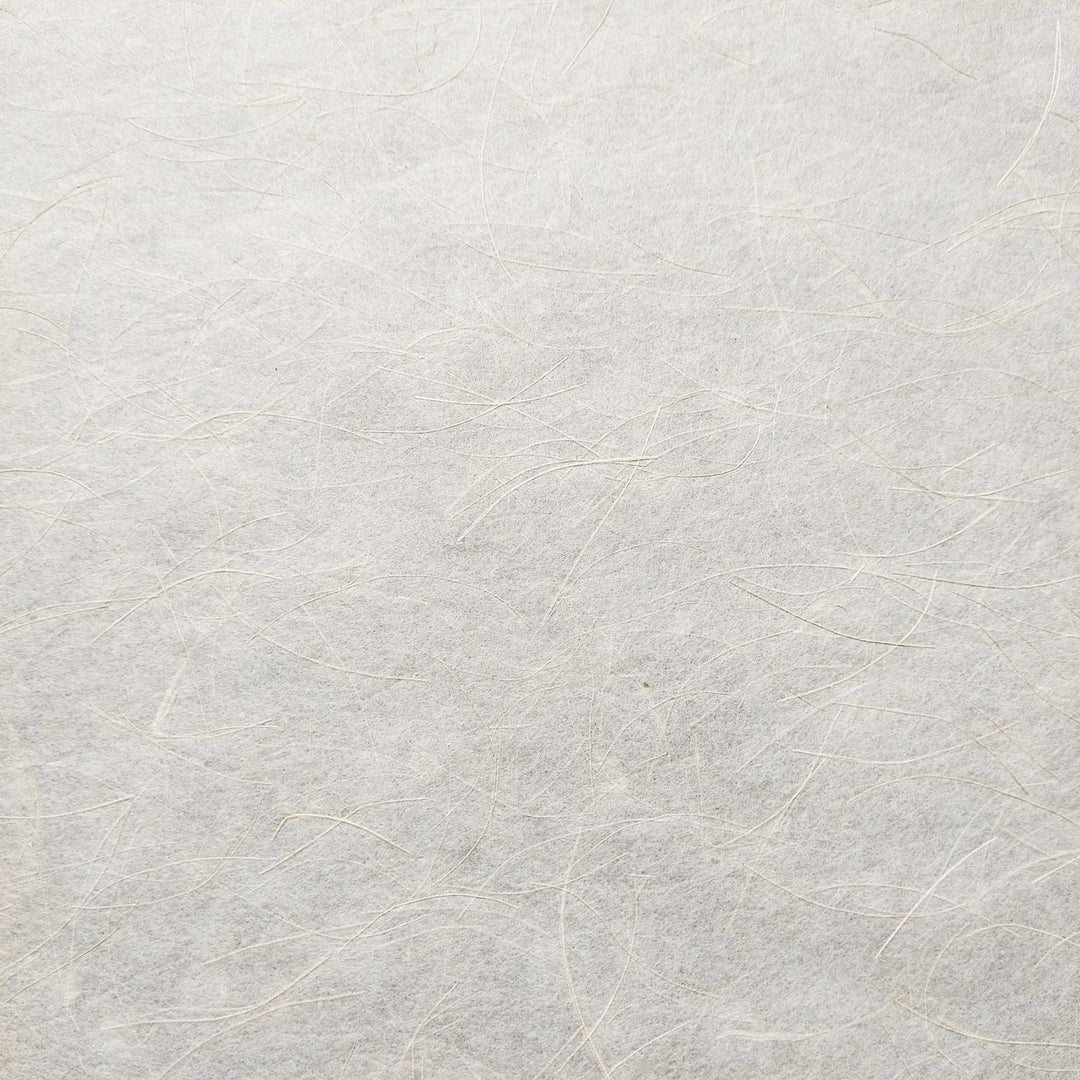 Mikado Kozo handmade paper from Kozo Studio, highlighting soft mulberry fibers blended with shiny hemp for a refined, organic appearance.