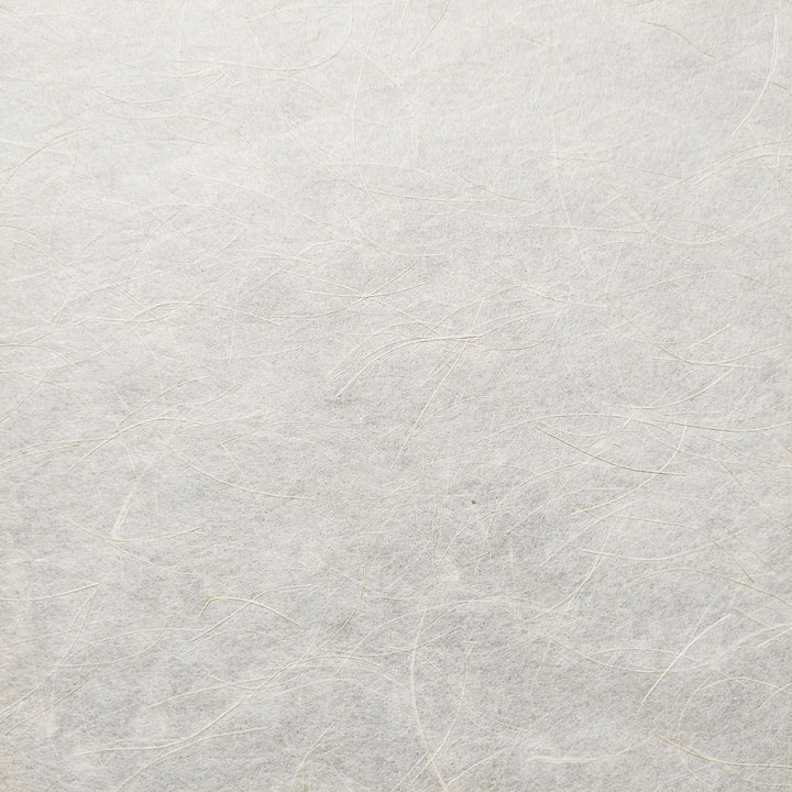 Mikado Kozo handmade paper from Kozo Studio, highlighting soft mulberry fibers blended with shiny hemp for a refined, organic appearance.