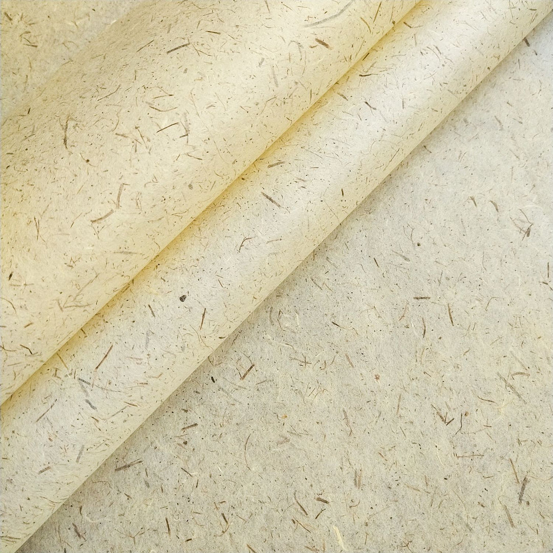 Pine Leaf Kozo handmade paper by Kozo Studio featuring semi-translucent mulberry fibers, natural pine leaves, and a rustic beige texture perfect for eco-friendly art projects.