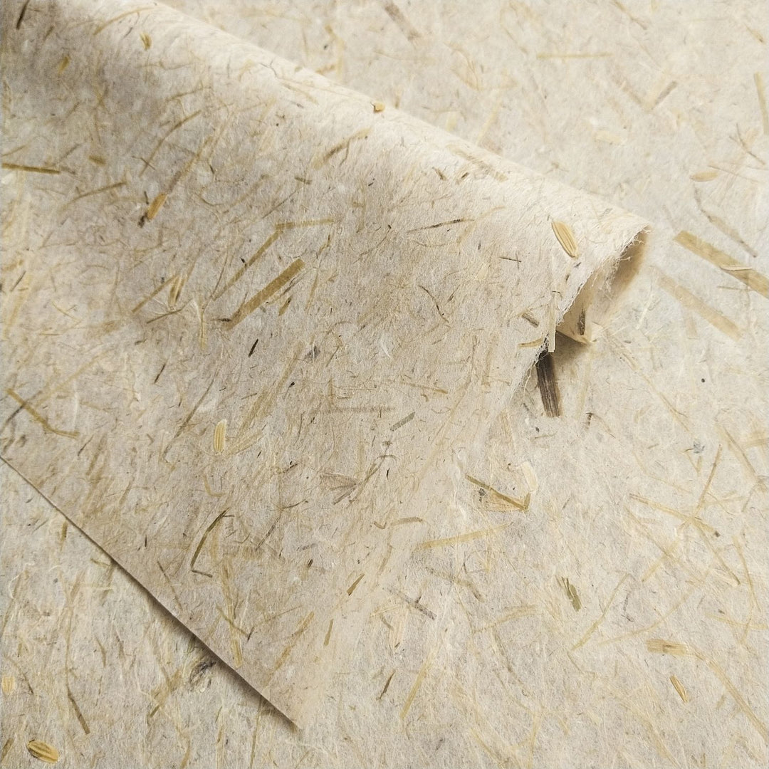 Kozo Studio handmade paper sheet made from mulberry pulp and grain by-products, with rice straw details giving it a raw, earthy aesthetic.