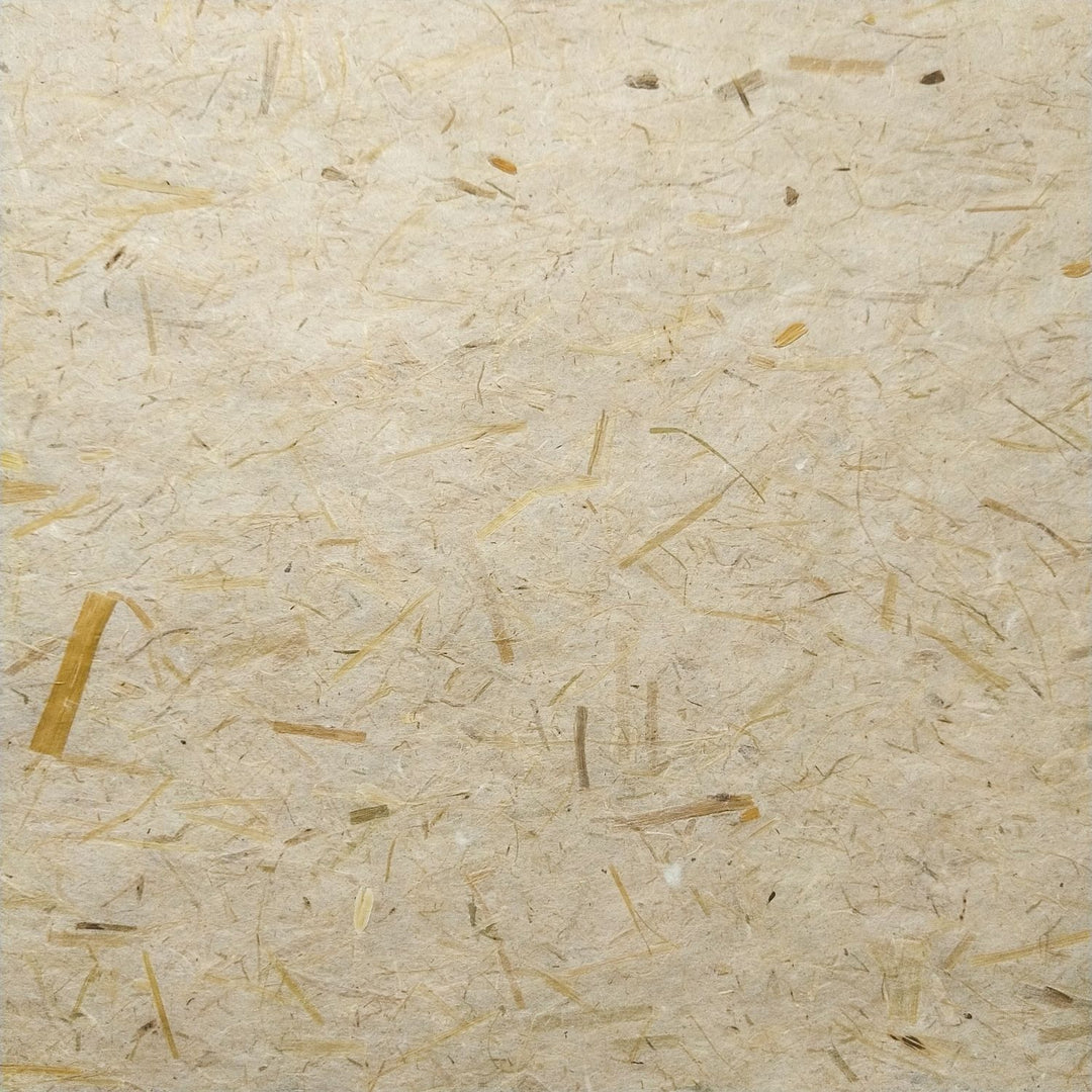 Detailed image of Kozo Studio rice straw mulberry paper with a rustic texture and curled edges, crafted using traditional handmade paper techniques.