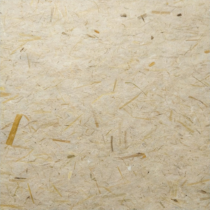Detailed image of Kozo Studio rice straw mulberry paper with a rustic texture and curled edges, crafted using traditional handmade paper techniques.