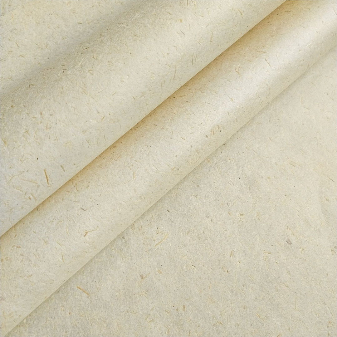 Close-up of Kozo Studio handmade paper crafted from sugarcane bagasse and kozo pulp, showcasing natural fibers and creamy texture, ideal for sustainable art projects.