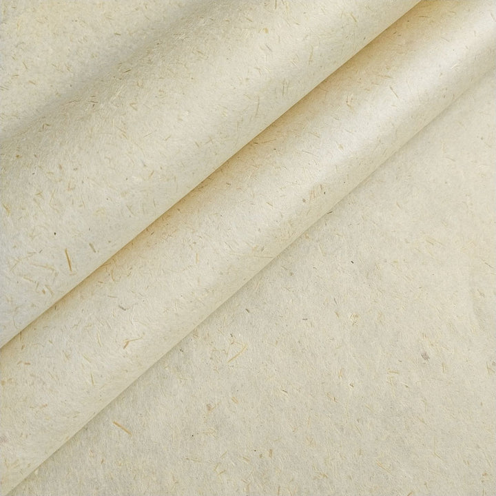 Close-up of Kozo Studio handmade paper crafted from sugarcane bagasse and kozo pulp, showcasing natural fibers and creamy texture, ideal for sustainable art projects.