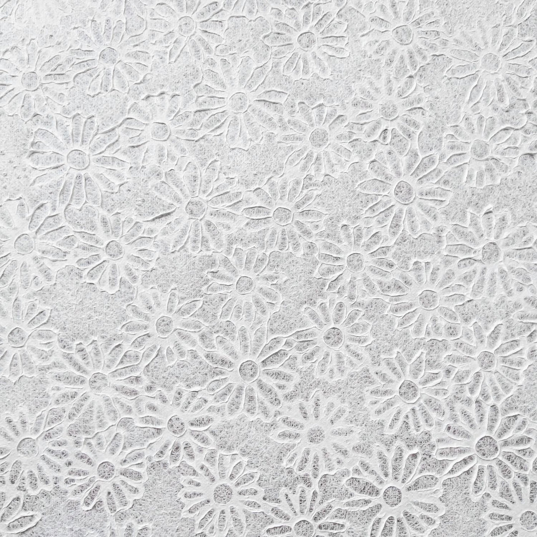 Delicate and translucent mulberry paper sheet featuring daisy embossing, handcrafted at Kozo Studio with the Rakusui technique for artistic and DIY use.