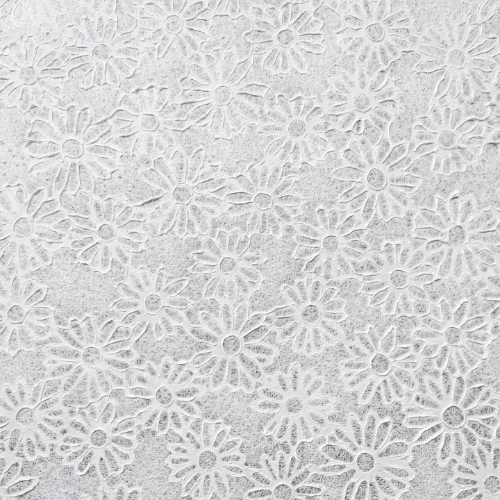 Delicate and translucent mulberry paper sheet featuring daisy embossing, handcrafted at Kozo Studio with the Rakusui technique for artistic and DIY use.