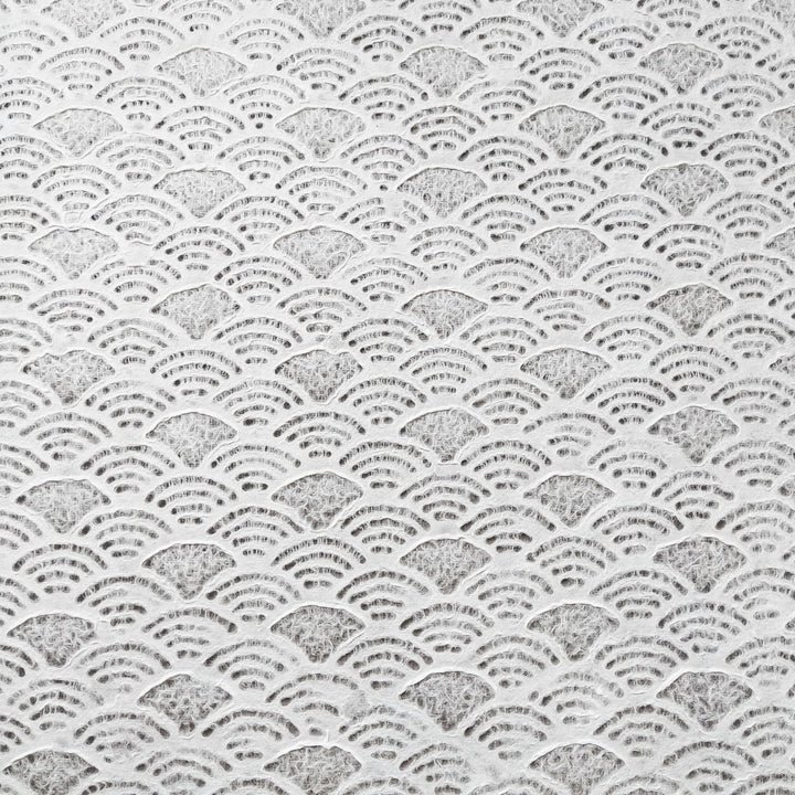 The handmade Lace Kozo Mulberry Paper (Fan) by Kozo Studio features an intricate pattern of overlapping semi-circles resembling fish scales or ocean waves on the delicate texture of rice paper, in uniform shades of white and gray.