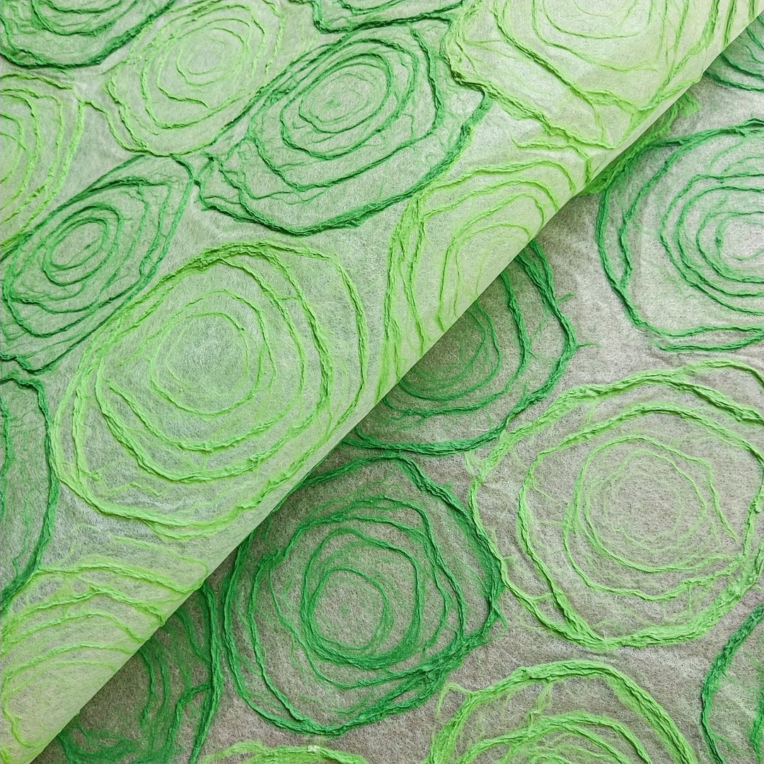 Handmade green and light green rose Kozo paper from Kozo Studio, featuring hand-drawn pulp circles on delicate mulberry paper, ideal for elegant lamp and window shade designs.