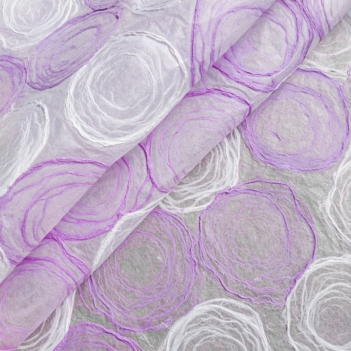 Stylish kozo handmade paper crafted by Kozo Studio with light purple and white hues on mulberry paper, great for both artistic and functional designs.