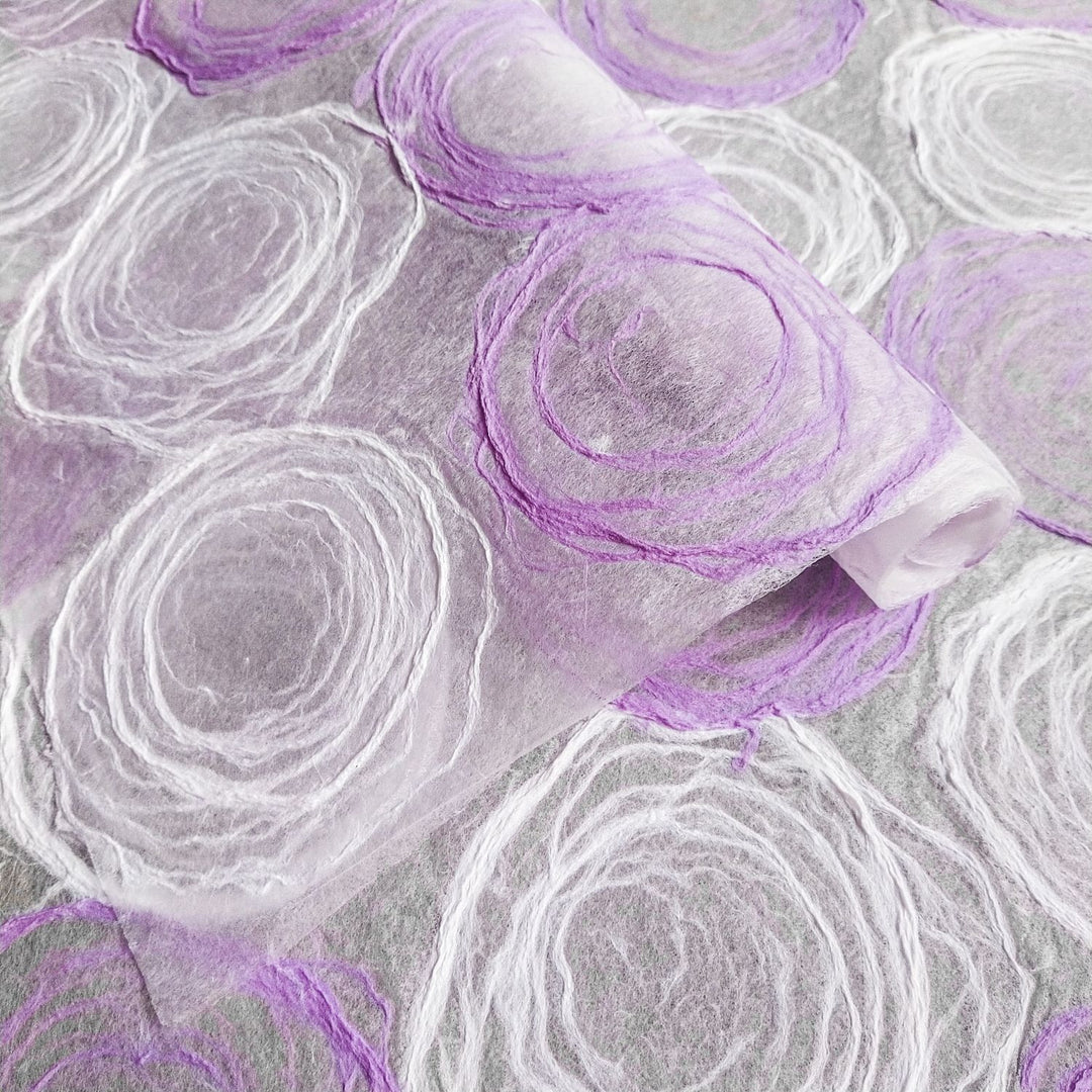 Artistic handmade kozo paper in soft purple and white tones, made with mulberry paper by Kozo Studio, ideal for lamp shades, window panels, and creative crafts.