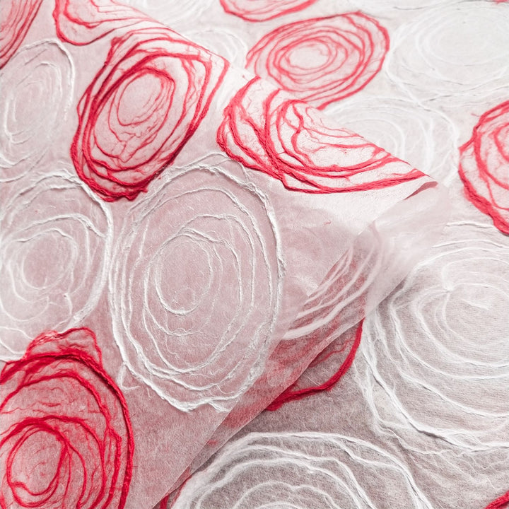 Kozo Studio handmade paper crafted with care, using thin mulberry sheets and red-white pulp circles for elegant and versatile projects.