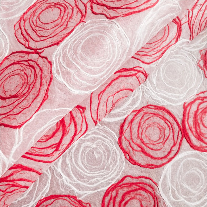 Translucent red and white kozo paper designed by Kozo Studio, made from handmade mulberry paper with unique circular textures.
