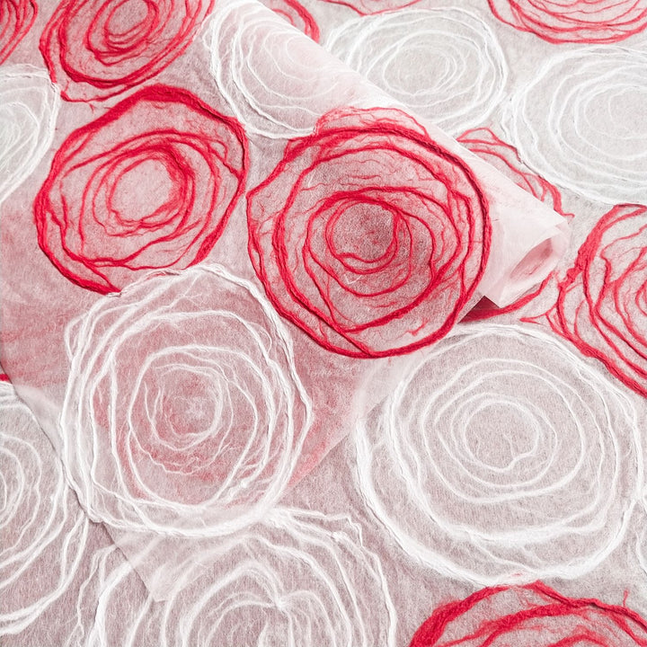 Delicate rose-inspired kozo paper in red and white, handmade on mulberry sheets by Kozo Studio, ideal for window shades and crafts.