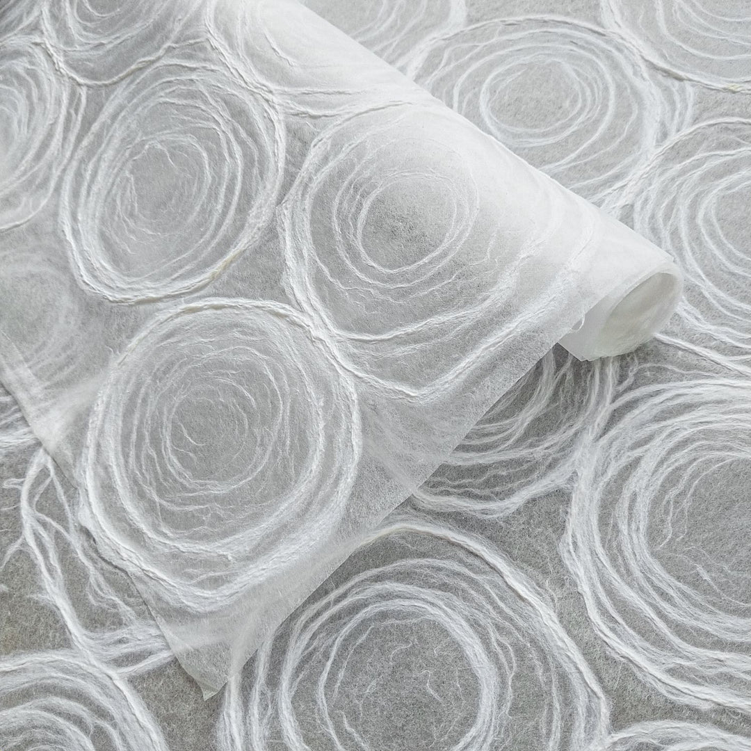 Kozo Studio handmade paper featuring delicate rose designs on translucent mulberry paper, ideal for windows, lamps, and crafts.