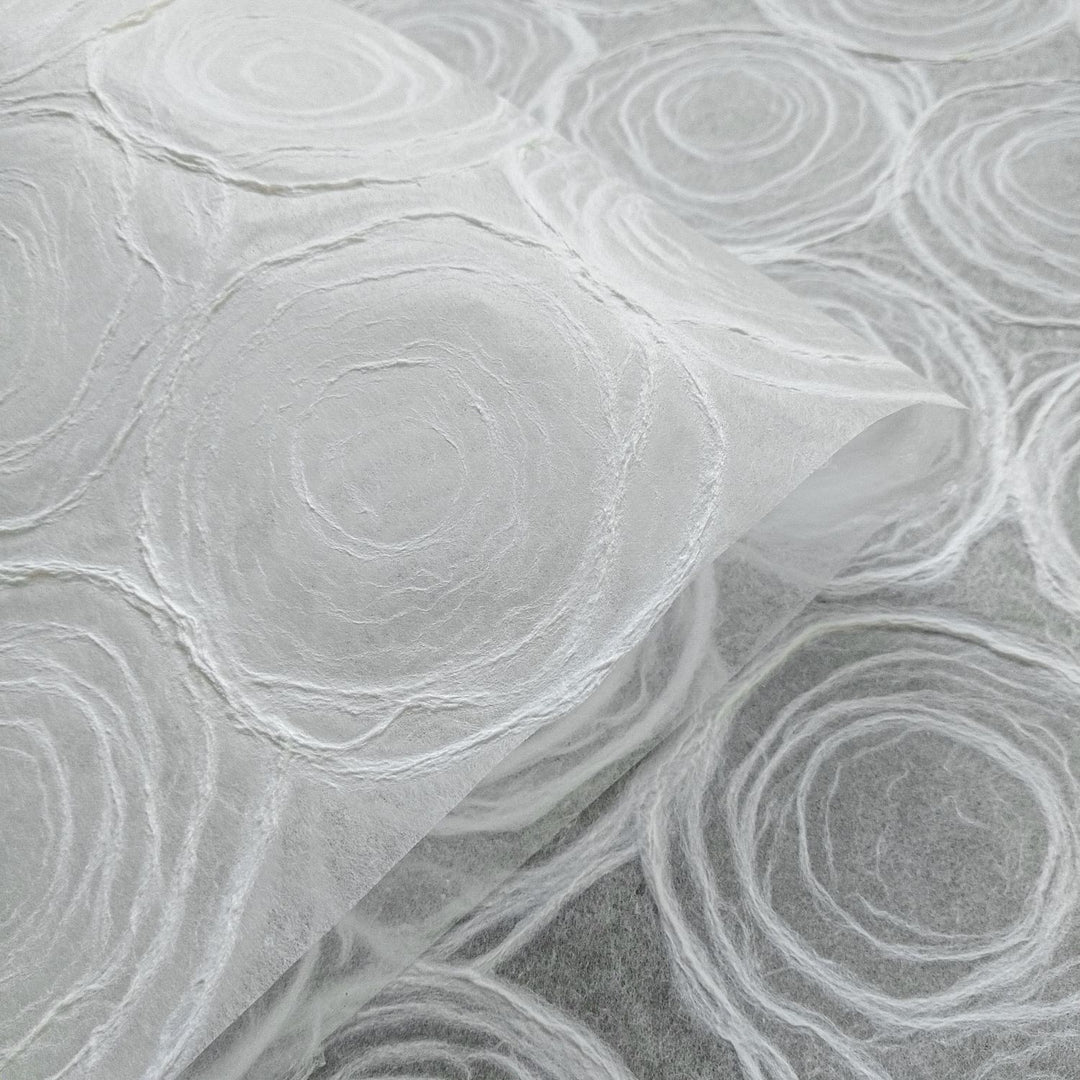 Unique mulberry paper sheet designed by Kozo Studio with handmade rose patterns, ideal for crafting and lighting applications.