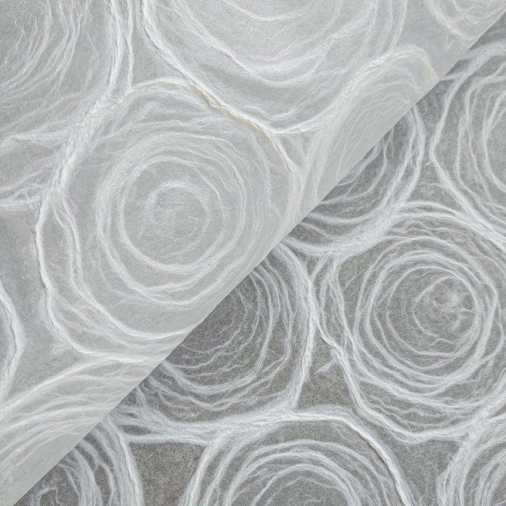 Handmade rose kozo paper in white with translucent mulberry base, crafted by Kozo Studio for lampshades and artistic projects.