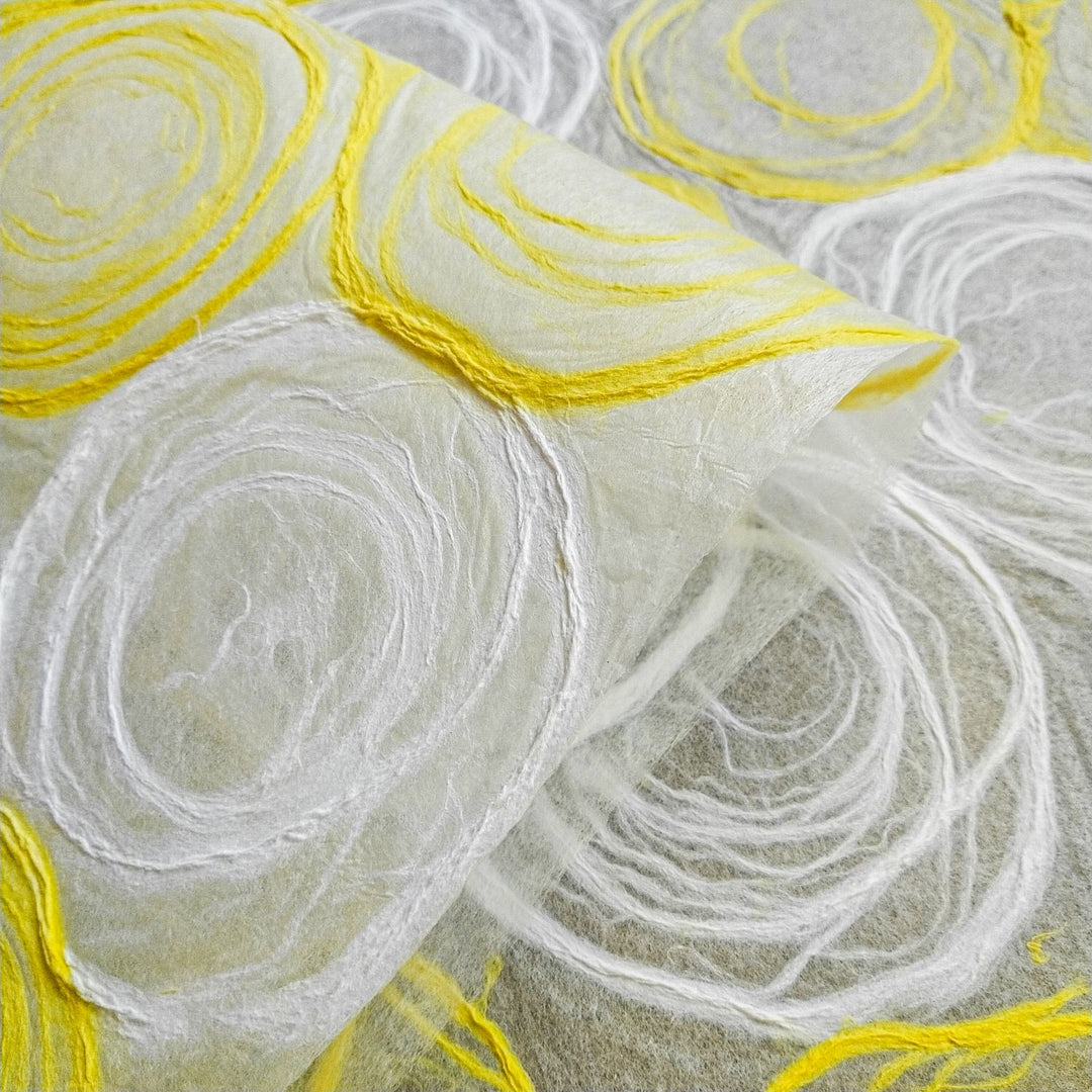 Decorative mulberry paper designed at Kozo Studio with handmade rose shapes in yellow and white, great for window shades, lamps, and creative projects.
