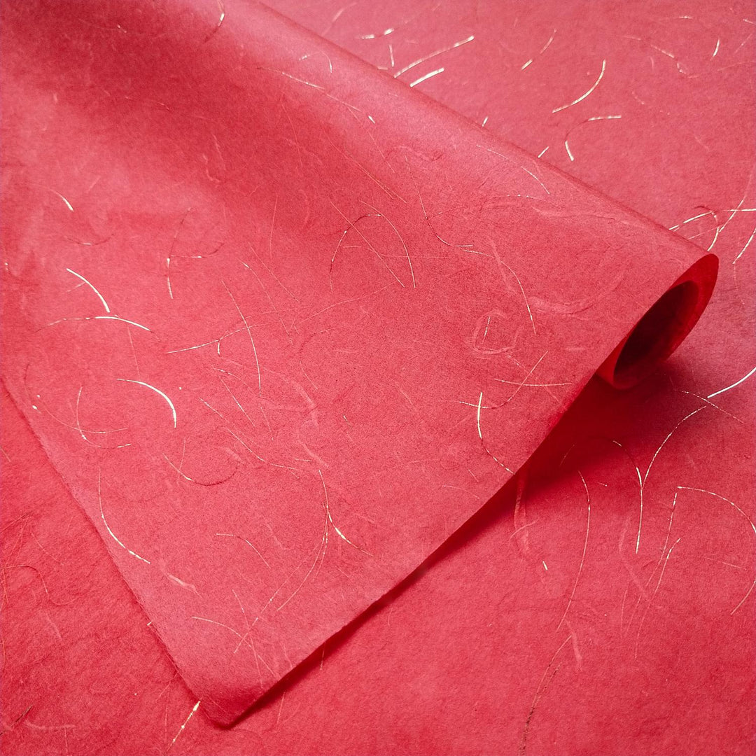 A sheet of Unryu-style handmade paper from Kozo Studio, showcasing shimmering golden accents and airy, textured mulberry paper with strong kozo fibers.