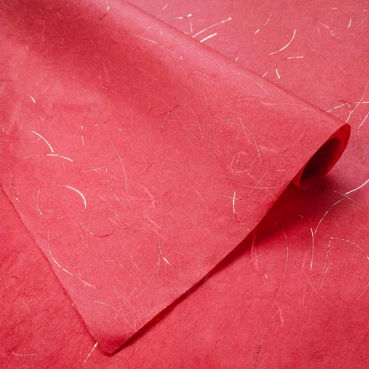 A sheet of Unryu-style handmade paper from Kozo Studio, showcasing shimmering golden accents and airy, textured mulberry paper with strong kozo fibers.